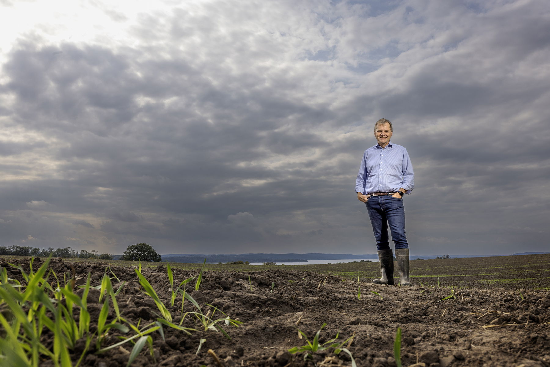 employee wearing rubber boots in a field