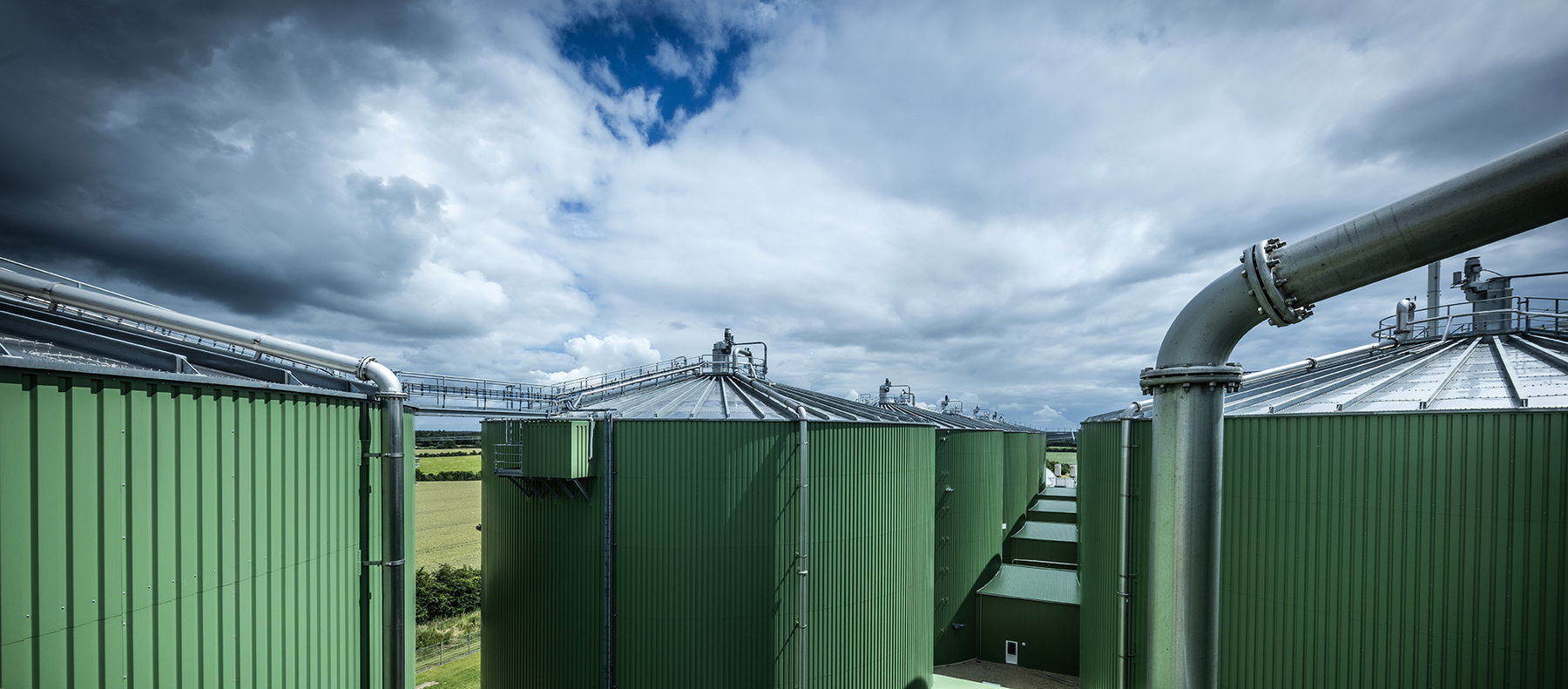 reactor tanks with sky as backdrop
