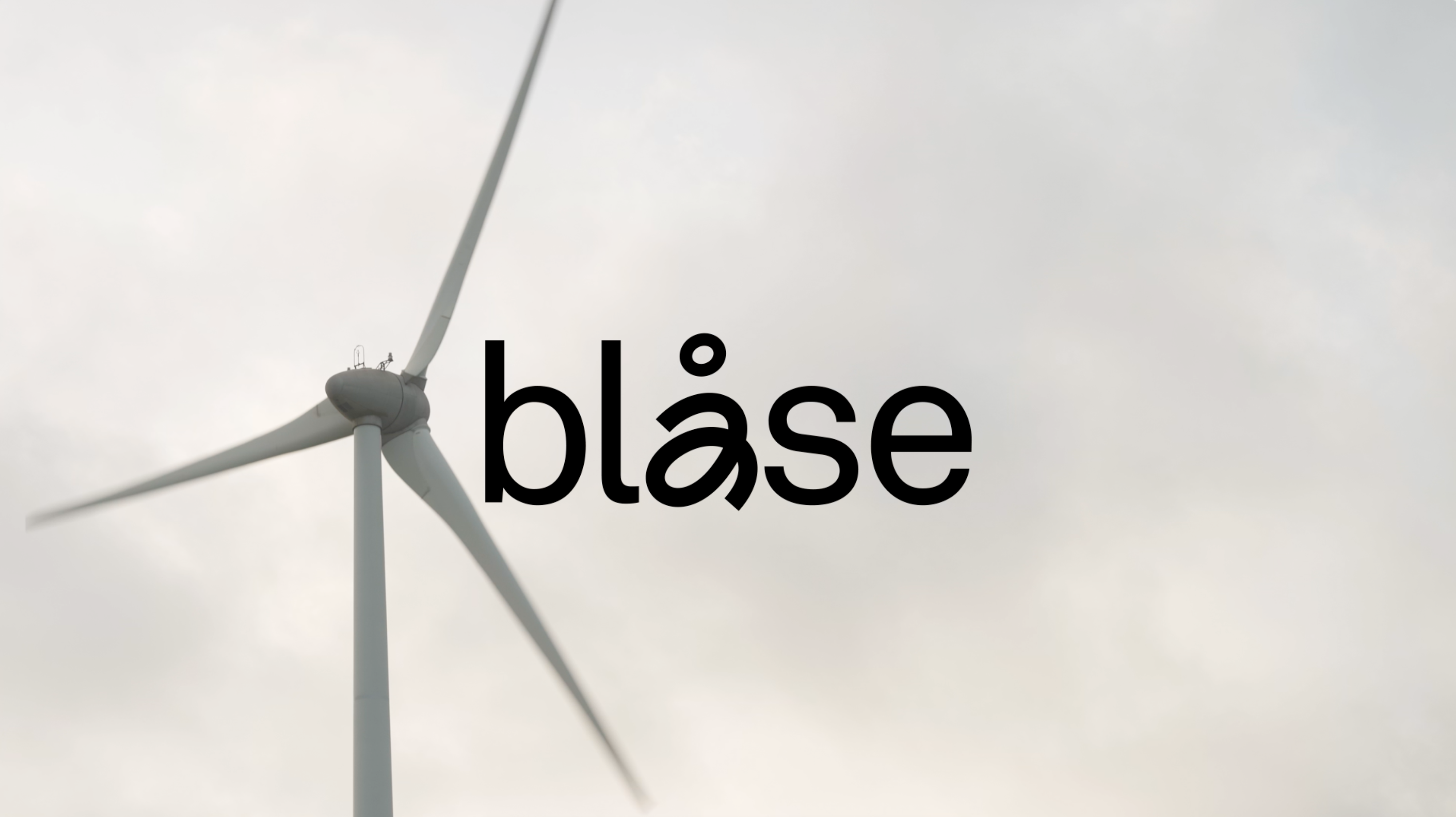 windmill in the background with logo animation on top