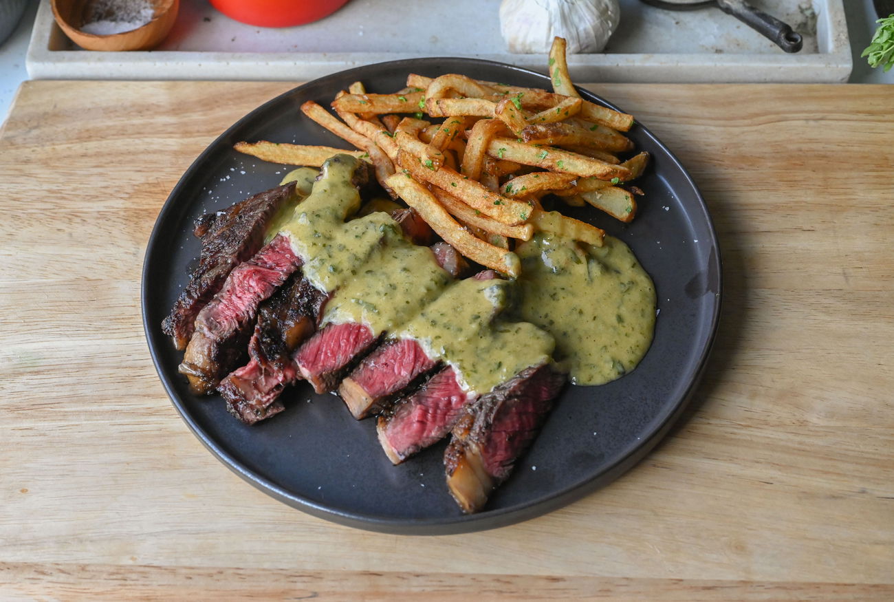 Entrecôte Café de Paris - Perfect steak with french fries and lovely sauce-image