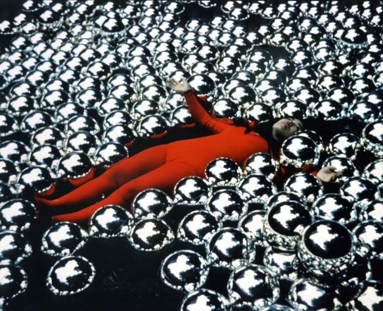 Yayoi Kusama lying in Narcissus Garden 1966 Venice Biennial
