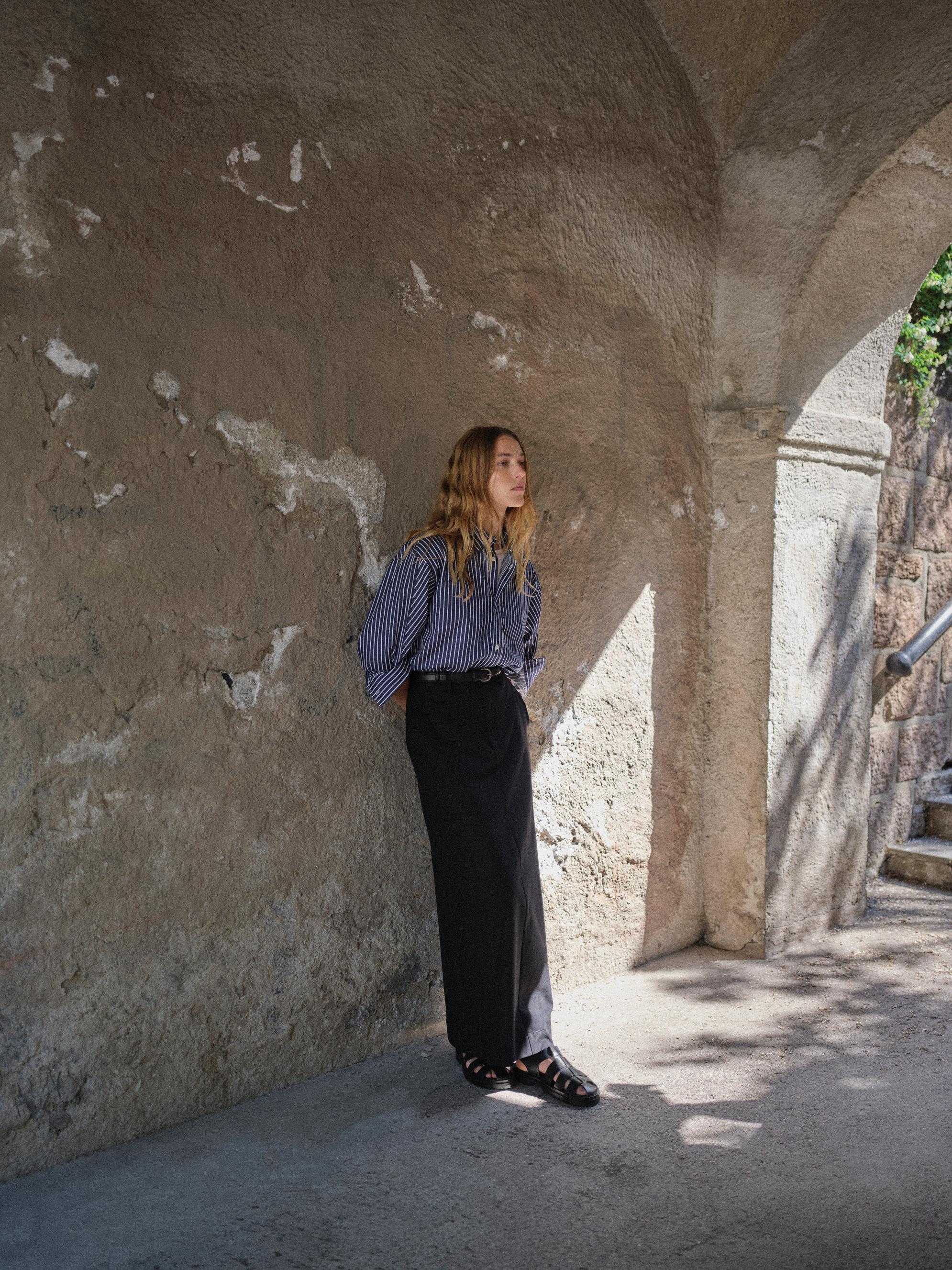 FWSS FALL 2024 CAMPAIGN TRINE HISDAL COASTAL SHIRT NAVY BLUE WHITE STRIPE COTE DAZUR MAXI SKIRT JET BLACK CLASSIC LEATHER BELT